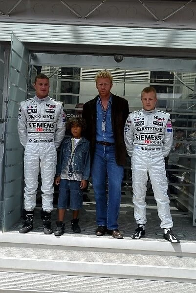 Formula One World Championship: Tennis legend Boris Becker and son are flanked by David Coulthard and his McLaren team mate Kimi Raikkonen