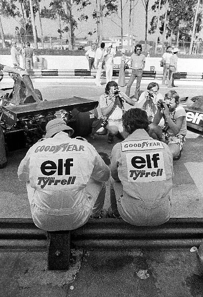 Formula One World Championship: thirteenth placed Jody Scheckter and his eighth placed Tyrrell team mate Patrick Depailler sit in the pits as