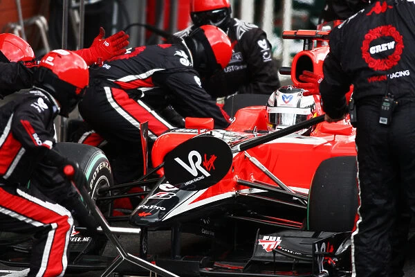 Formula One World Championship: Timo Glock Virgin Racing VR-01 makes a pit stop