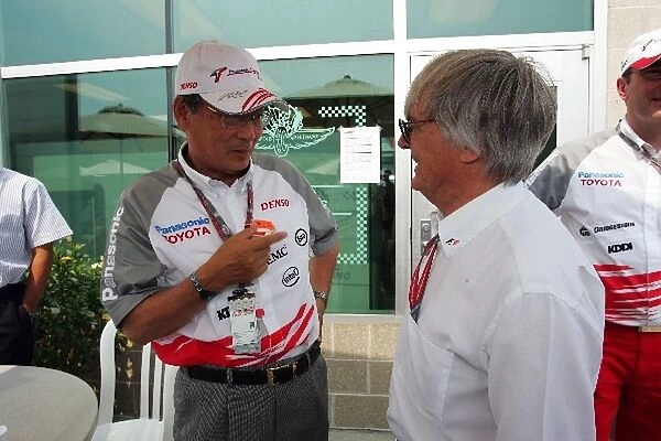 Formula One World Championship: Tokuichi Uranishi Toyota Executive Vice President Sales & Marketing with Bernie Ecclestone F1 Supremo
