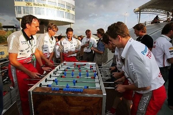 Formula One World Championship: Toyota employees play table football at the Chilled Thirstday party at the Red Bull Racing Energy Station