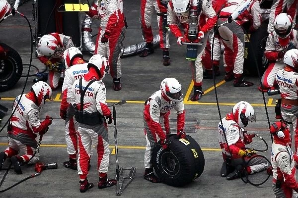 Formula One World Championship: Toyota prepare for a pit stop