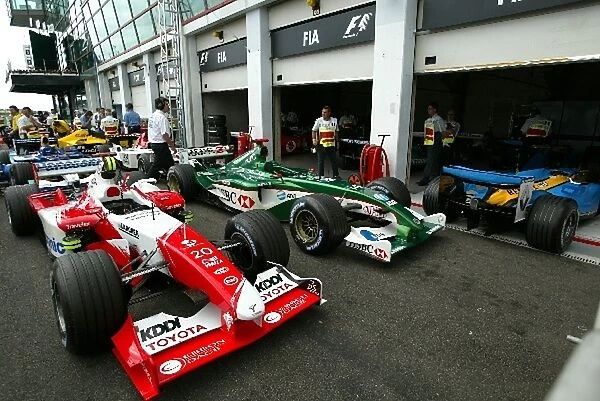 Formula One World Championship: Toyota TF103 and Jaguar R4 in the parc ferme area