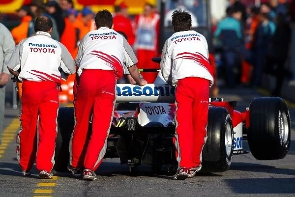Formula One World Championship: A Toyota TF105 is pushed down the pitlane