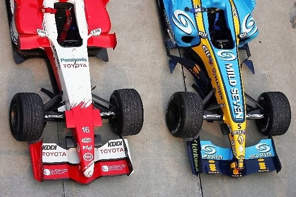 Formula One World Championship: The Toyota TF105 of second placed Jarno Trulli and the Renault R25 of race winner Fernando Alonso in parc ferme