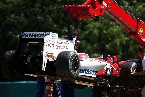 Formula One World Championship: The Toyota TF109 of Jarno Trulli Toyota is craned away after stopping on the circuit