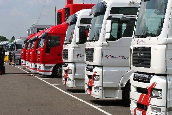 Formula One World Championship: Trucks lined up in the paddock