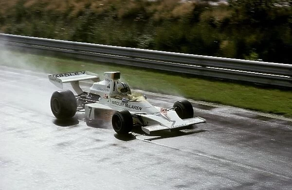 Formula One World Championship: Twelfth placed Denny Hulme McLaren M23 practices during the wet Saturday sessions
