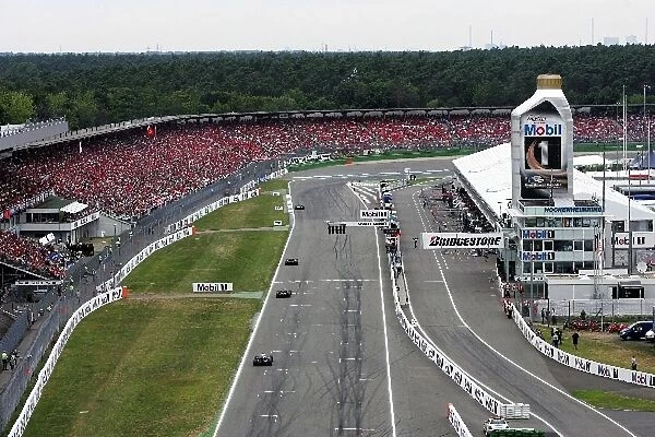 Formula One World Championship: View from high in the grandstand as Kimi Raikkonen McLaren Mercedes MP4-20 leads