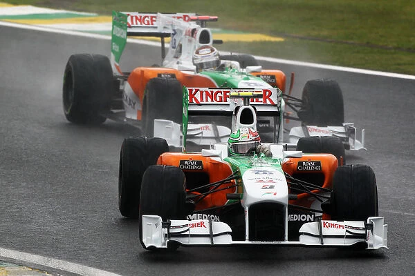 Formula One World Championship: Vitantonio Liuzzi Force India F1 VJM03 leads team mate Adrian Sutil Force India F1 VJM03