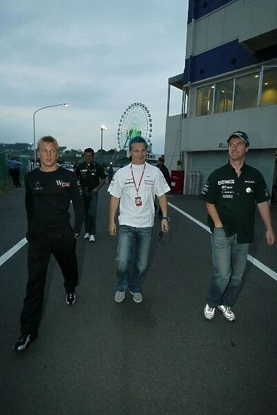 Formula One World Championship: The walk from the paddock: Kimi Raikkonen McLaren; Mika Salo Toyota; Eddie Irvine Jaguar