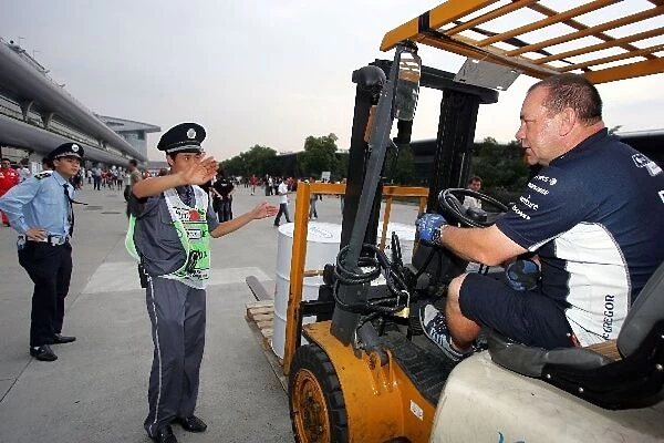 Formula One World Championship: The Williams fuel delivery is stopped at the paddock gates