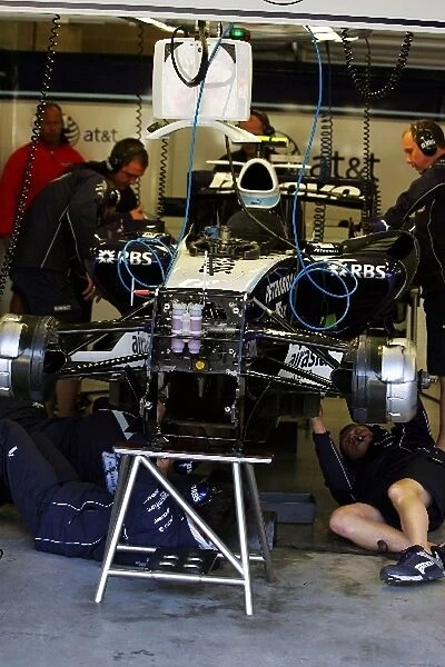 Formula One World Championship: Williams FW28 is worked on in the pits