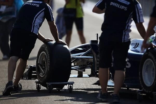Formula One World Championship: A Williams FW31 is pushed down the pitlane
