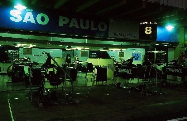 Formula One World Championship: Williams mechanics keep the pitlane alive working throught the night
