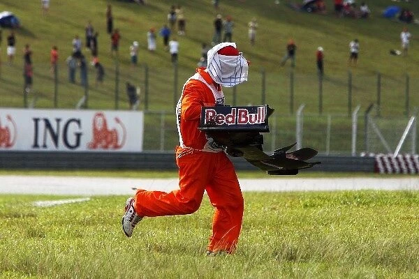 Formula One World Championship: The front wing of Sebastien Buemi Scuderia Toro Rosso is recovered