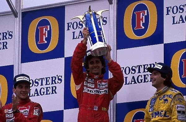 Formula One World Championship: Winner Alain Prost McLaren MP4  /  4, with 2nd placed Ayrton Senna McLaren MP4  /  4 and Nelson Piquet Lotus 100T, 3rd place