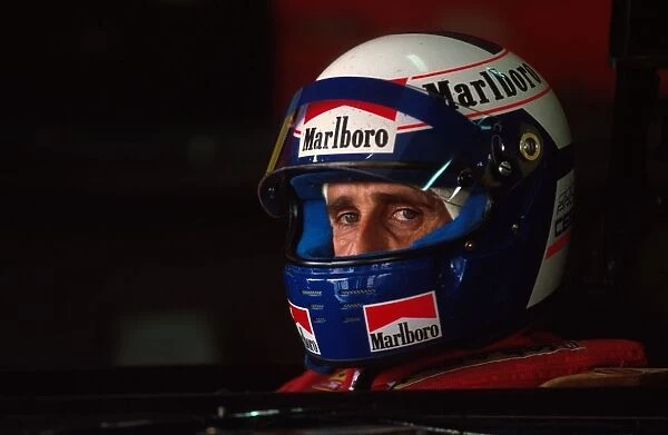 Formula One World Championship: Winner Alain Prost Ferrari 641 sits in his car during qualifying