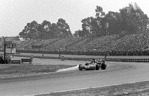 Formula One World Championship: Winner Jackie Stewart Tyrrell 003, in front of the vast crowd