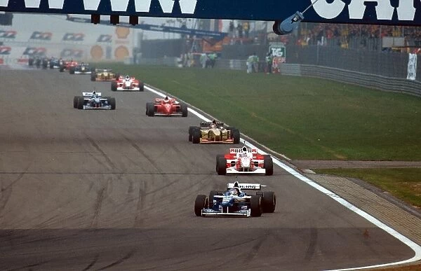 Formula One World Championship: Winner Jacques Villeneuve Williams FW18 leads David Coulthard