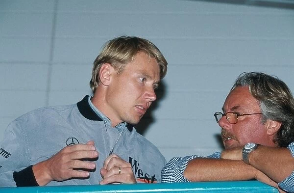 Formula One World Championship: Winner Mika Hakkinen with his manager former World Champion Keke Rosberg