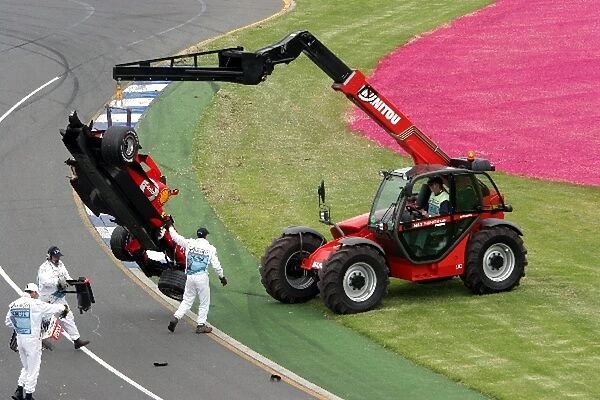 Formula One World Championship: The wreck of Felipe Massa Ferrari 248 F1 is removed from the circuit