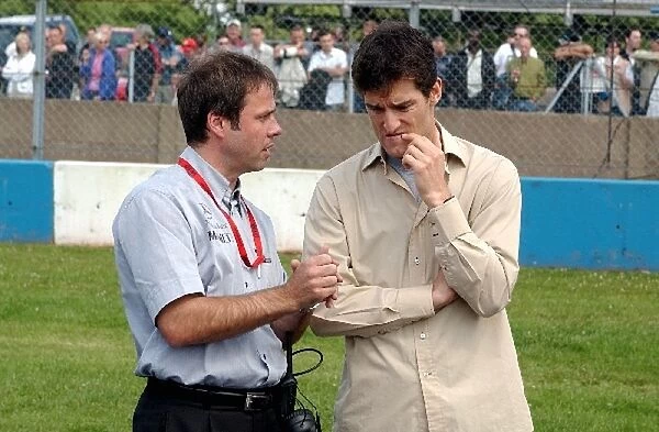 Gerhard Ungar (GER), Chief Designer AMG, left, talking with Formula One driver Mark Webber