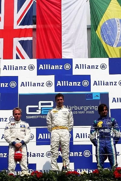 GP2: The podium: Adam Carroll Supernova, second; Clivio Piccione Durango, winner; Nelson Angelo Piquet Hi-Tech Piquet Sports, third