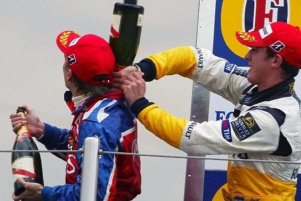 GP2: The podium: Race winner Heikki Kovalainen Arden International with second placed Jose Maria Lopez DAMS