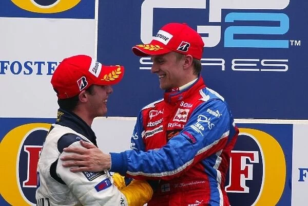 GP2: The podium: second placed Jose Maria Lopez DAMS congratulates race winner Heikki Kovalainen Arden International