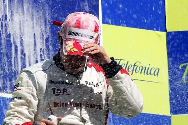 GP2 Series: Kamui Kobayashi Dams celebrates his win on the podium