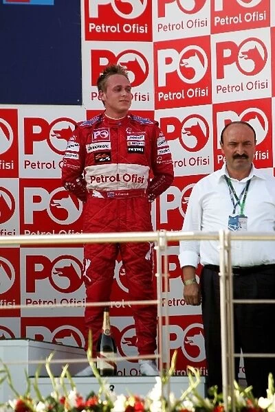 GP2 Series: Third placed Adam Carroll FMS International on the podium
