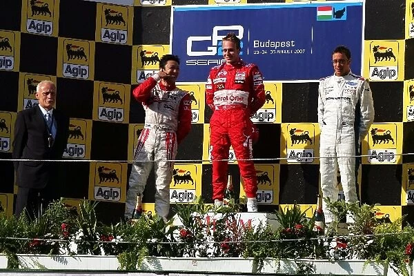 GP2 Series: The podium: Kazuki Nakajima Dams, second; Adam Carroll FMS International, race winner; Andreas Zuber iSport International, third