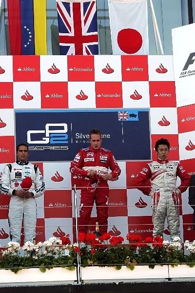 GP2 Series: The podium: Pastor Maldonado Trident Racing, Adam Carroll FMS International, race winner; Kazuki Nakajima Dams, third