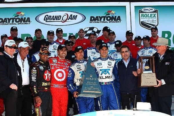 Grand-Am: L-R: Juan Pablo Montoya, Dario Franchitti, Memo Rojas and Scott Pruett receive the trophy for winning the Rolex 24 at Daytona