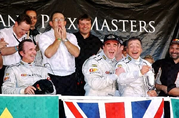 Grand Prix Masters: The podium: Emerson Fittipaldi second; Nigel Mansell winner; Riccardo Patrese third