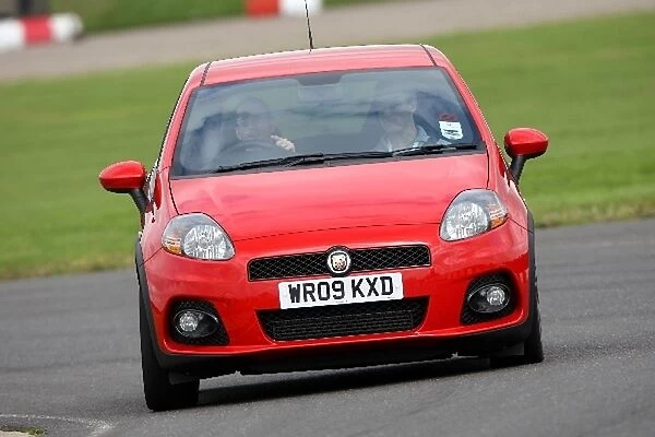 Grand Prix Shootout: Danny Watts demonstrates the capabilities of the FIA Grande Punto Abarth to candidate Steve Bell