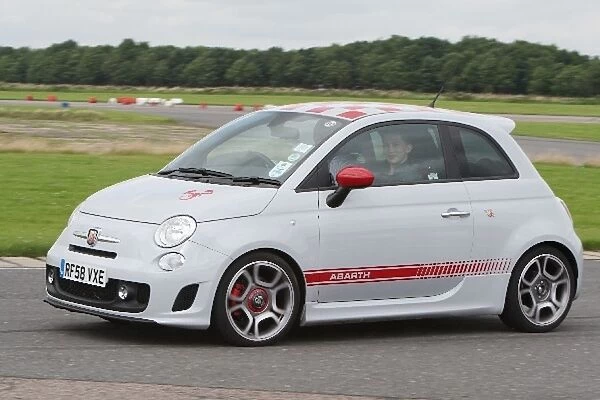 Grand Prix Shootout: Driver coach Rob Wilson demonstrates the capabilities of a FIAT 500 Abarth to Mackenzie Taylor