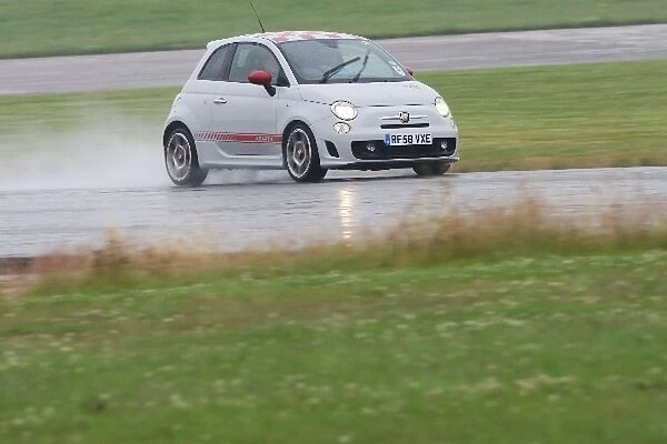 Grand Prix Shootout: A driver is evaluated in a FIAT 500 Abarth