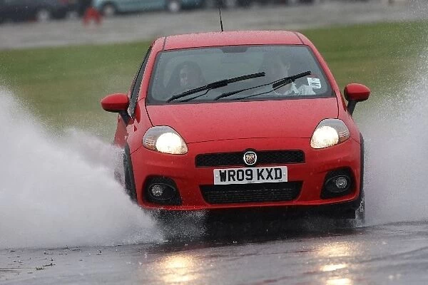Grand Prix Shootout: A driver is evaluated in a FIAT Grande Punto Abarth