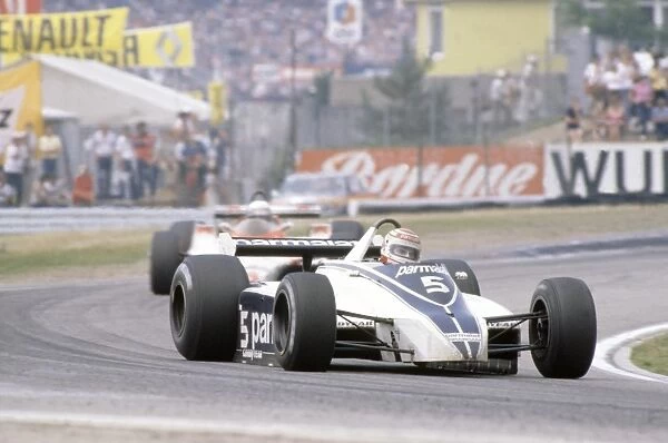 Hockenheim, Germany. 8-10 August 1980: Nelson Piquet, 4th position, leads Alain Prost, 11th position