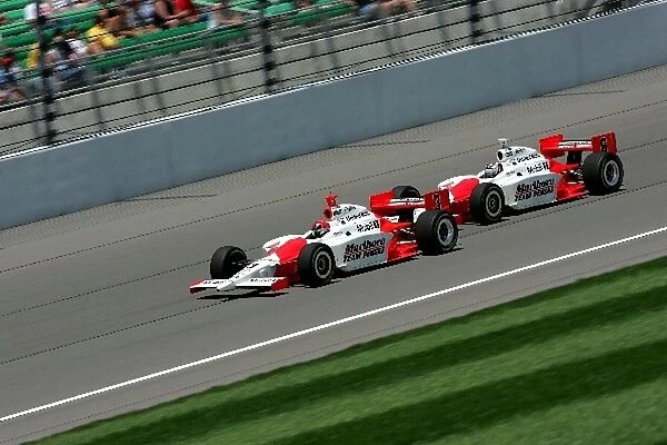 Indy Racing League: Helio Castroneves leads teammate Sam Hornish Jr. in the Argent Mortgage Indy 300, Kansas Speedway, Kansas City, KS, 04, July, 2004