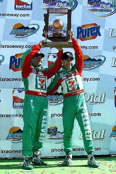 Indy Racing League: Race winner Tony Kanaan, right, celebrates with Andretti Green Racing team owner, Michael Andretti on the podium