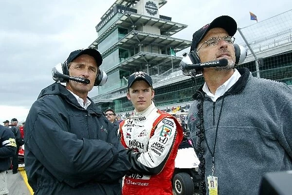 Indy Racing League: Rookie Dan Wheldon Andretti Green Racing Dallara Honda watches qualifying with team owners Barry and Kim Green