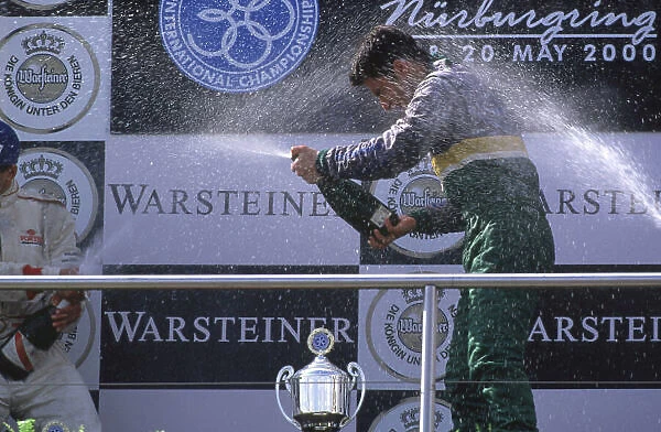 International Formula 3000 Championship. Nurburgring, Germany. 19th - 20th May 2000. Race winner Bruno Junqueira ( Petrobras Jnr Team ), sprays the champagne. World Bellanca / LAT Photographic Tel: +44 (0) 208 251 3000 Fa