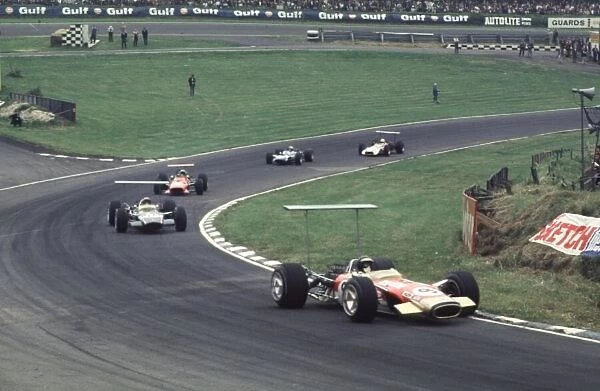 Jackie Oliver leads Siffert, Amon, Stewart and Surtees British Grand Prix