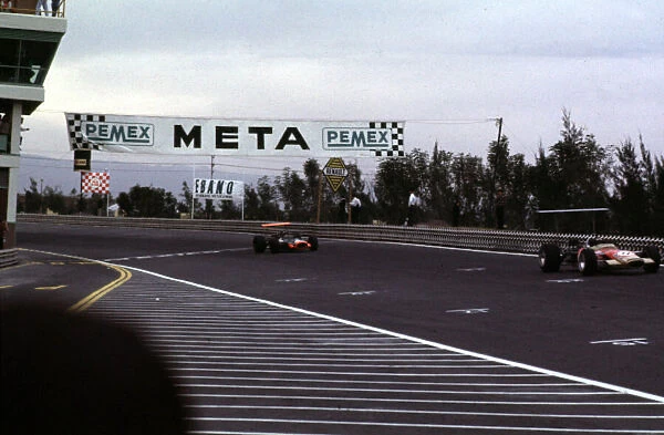 Jackie Oliver (Lotus 49B) leads Pedro Rodriguez Mexican Grand Prix, Mexico City