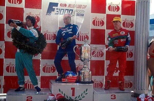 Japanese Formula 3000 Championship: The podium: Kazuyoshi Hoshino second ├É not wasting the champagne, Ross Cheever winner, with Eddie Irvine