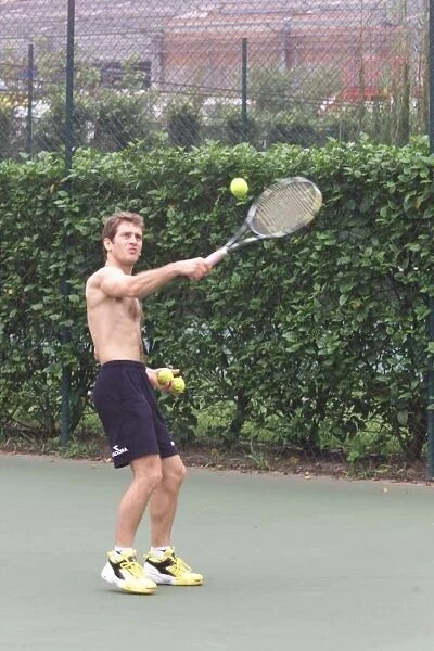 Jarno Trulli enjoys a game of tennis