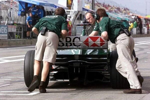 Johnny Herbert is pushed out of the garage